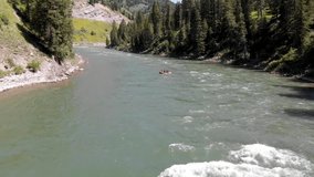 Video of a group of tourists having fun doing rafting on a river in Wyoming, USA