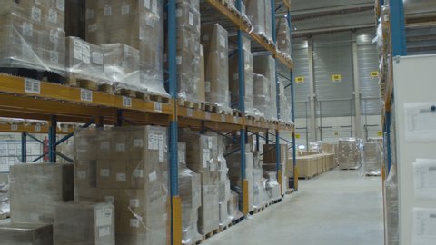 Tilt down of high rack in industrial warehouse