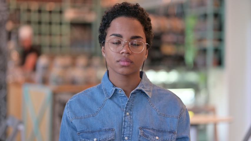 Portrait of Exhausted African Woman Yawning 