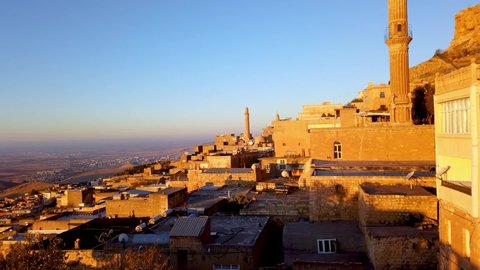 Mardin, Turkey - November 2019: Time lapse video of sunrise over Mardin Old city cityscape
