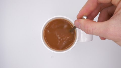 Slow Motion Stirring A Hot Drink in a White Mug
