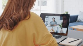Young Asian woman video call conference, online remote meeting with business coworker, at home. New normal lifestyle, social distancing, internet technology, businesswoman work from home concept