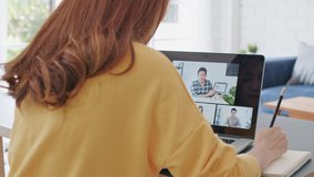 Young Asian woman video call conference, online remote meeting with business coworker, at home. New normal lifestyle, social distancing, internet technology, businesswoman work from home concept - Powered by Shutterstock - Get 15% off with code: PIKWIZARD15