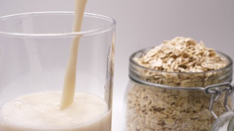 Pouring Oat Milk Into A Glass