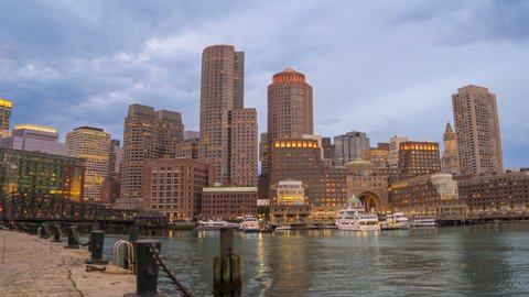 Downtown Boston, Massachusetts, USA: Sunset Time Lapse Skyline of Financial District From Fan Pier Park. 4K UHD