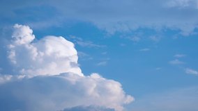Massive clouds - cumulus congestus or towering cumulus - forming in the blue sky - Powered by Shutterstock - Get 15% off with code: PIKWIZARD15