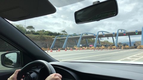 July 12, 2020. São Paulo, SP, Brazil. Woman driving and passing through the toll in Rodovia Dom Pedro highway.