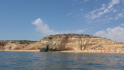 View from the sea of Carvoeiro beach. The Lagoa region has a coastline formed of towering cliffs, turquoise waters and picturesque beaches. The beaches of Carvoeiro are found within sheltered coves