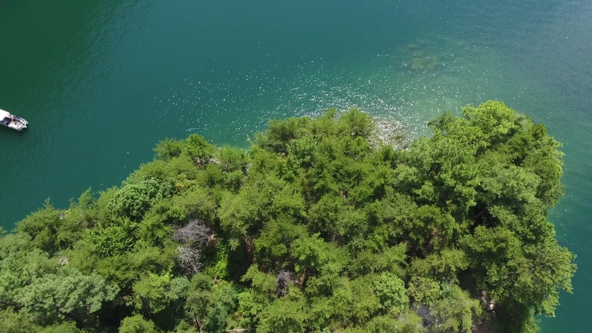 Aerial of boating on Lake Jocassee in upstate South Carolina on summer day for recreation. . High quality 4k footage