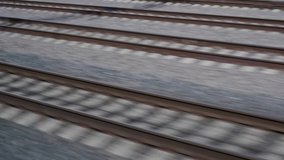 monotonous movement on the railway with a view of the rails and gray landscape, creating a peaceful atmosphere of the track - Powered by Shutterstock - Get 15% off with code: PIKWIZARD15