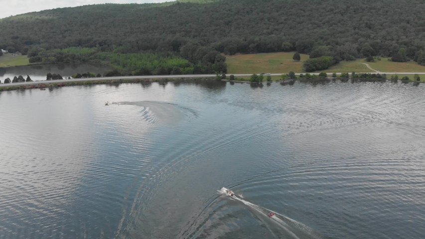 Aerial view of Tennessee lake with boats, trees, water, and other nature at a state park