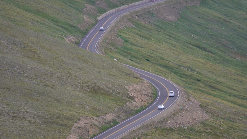 Car driving at high altitude mountain road in Colorado