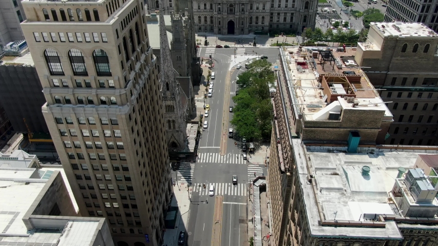 Aerial tilt up, Ben Franklin atop Philadelphia City Hall, view above Broad Street looking south Royalty-Free Stock Footage #1057528234