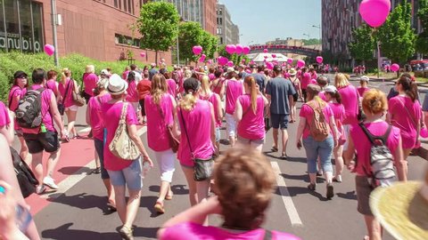 PRAGUE, CZECH REPUBLIC - 6 JUN 2015: Sponsored public walk event with thousands of people marching in the crowd to support breast cancer awareness. 