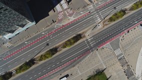 Top shot of Empty street in Warsaw city, Poland aerial view. Quarantined city, empty abandoned streets during corona virus outbreak. Drone shot flying over buildings, parked cars and street COVID - Powered by Shutterstock - Get 15% off with code: PIKWIZARD15