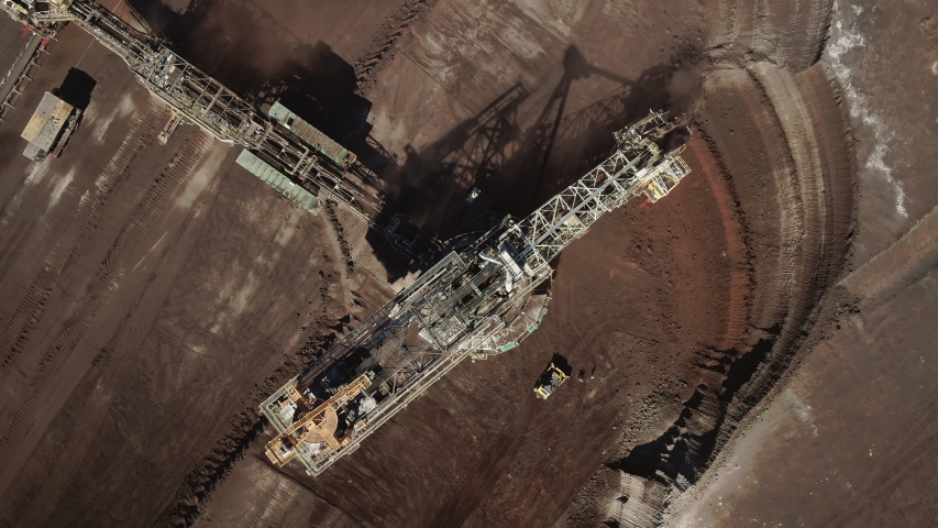 Top shot of a large bucket-wheel excavator in a lignite (brown-coal) mine aerial view