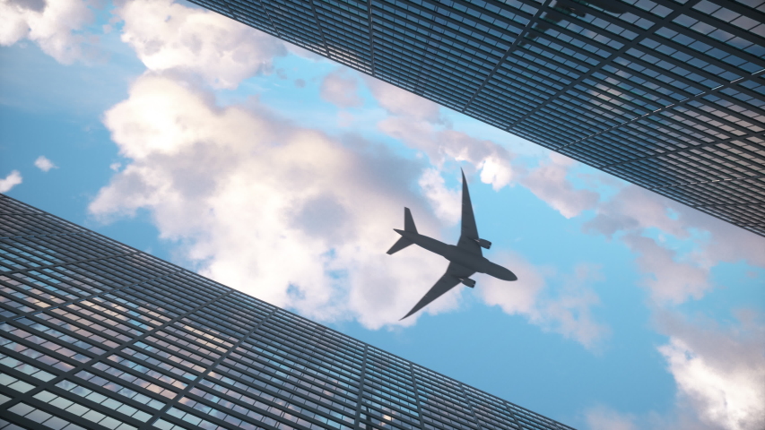 Airplane flying low over big city skyscrapers. 4K