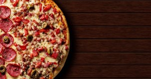 Pepperoni pizza with tomatoes, bacon and melted cheese, top view with wooden background and space for text