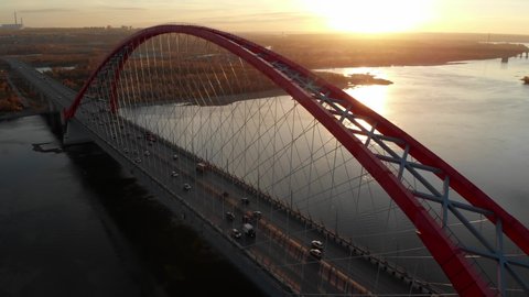aerial shot of a beautiful red bridge in Novosibirsk in the morning autumn 