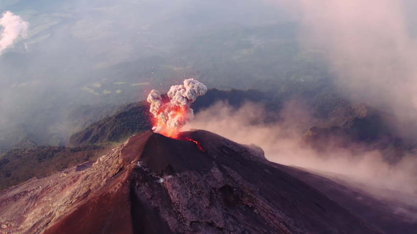 Complete, crazy flyover of the crater of Fuego, one of Guatemala's active volcanos. Shot ends with camera right above crater. More from this sequence available for sale. Royalty-Free Stock Footage #1057561570