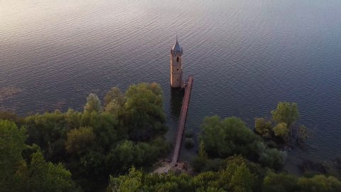 Aerial view of The fish cathedral. Sunken church ruins located in the Ebro reservoir in Cantabria, in the north of Spain. High quality 4k footage
