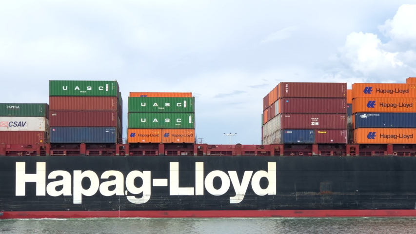 Oakland, CA - Aug 16, 2020:  4K HD video Tugboats assist Cargo Ship DALLAS EXPRESS to maneuver into the Port of Oakland. 2X normal speed. Hapag-Lloyd AG is the worlds fifth largest container carrier 
