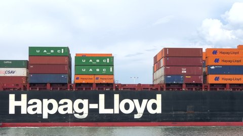 Oakland, CA - Aug 16, 2020:  4K HD video Tugboats assist Cargo Ship DALLAS EXPRESS to maneuver into the Port of Oakland. 2X normal speed. Hapag-Lloyd AG is the worlds fifth largest container carrier 
