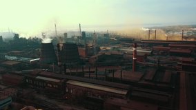 Steel mill metallurgical plant bad ecology smoke from pipes aerial video 4K.