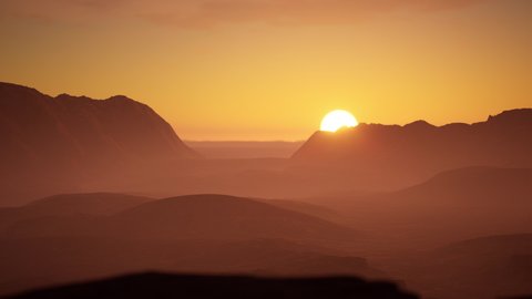 AERIAL View of a beautiful sunset over scenic mountain valley. Golden hour. 4K UHD