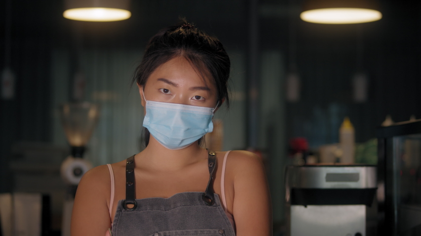 Asian young woman remove protective mask at work, covid coronavirus , healthy lifestyle, business owner in new normal post covid, second wave, girl barman smiling