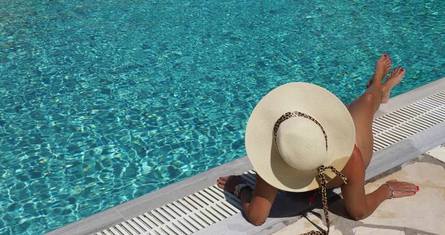 woman in luxury five stars  spa resort in the swimming pool. 