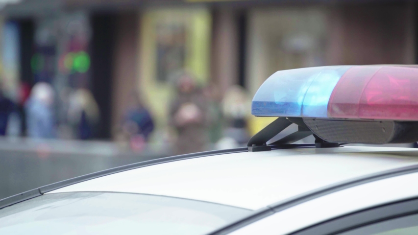 Police flasher flashing on the roof of the patrol car Royalty-Free Stock Footage #1057606261