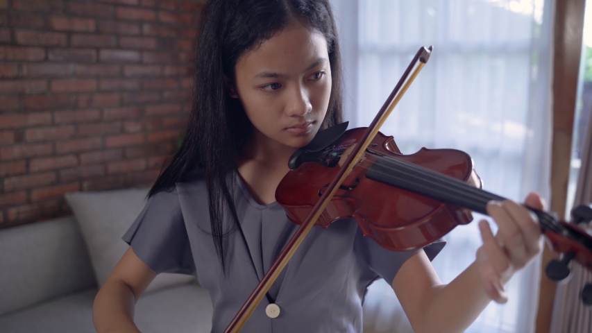 Asian girl playing violin
