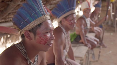 Amazonas / Brazil - August 22 2019: Close up shot of Tribe Sitting on Bench