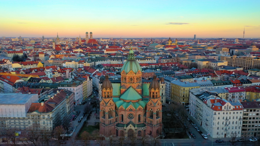 Drone video of Munich aerial skyline view from above view of city centre church and marienplatz square from above, sly over church isar river germany.  Royalty-Free Stock Footage #1057613143