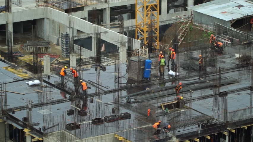 Time lapse construction site of monolithic buildings. Workers work at construction site reinforced concrete structures. Modern industrial monolithic construction | Shutterstock HD Video #1057616674
