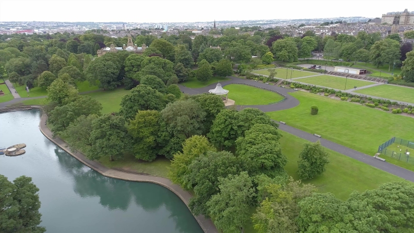 Aerial Drone of Lister Park in Bradford, Yorkshire.Trees, Band Stand and Pond