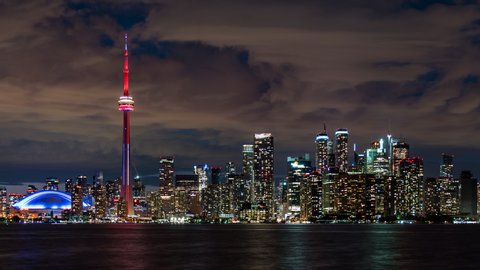 Toronto, Canada, dolly right, day to night time lapse sequence showing iconic Toronto skyline and Lake Ontario.