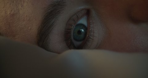 close up eye opening waking up after sleeping