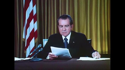 CIRCA 1970s - President Richard Milhous Nixon reads statements regarding the Watergate Scandal, in Washington, D.C., in 1973.