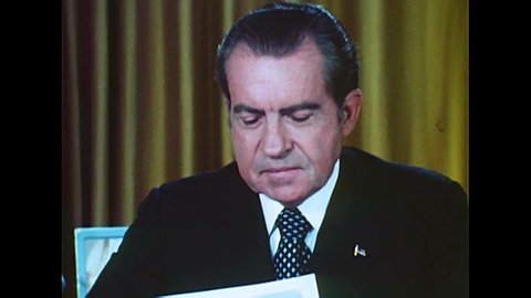 CIRCA 1970s - President Richard Milhous Nixon reads statements to do with charges in the Watergate Scandal, in Washington, D.C., in 1973.