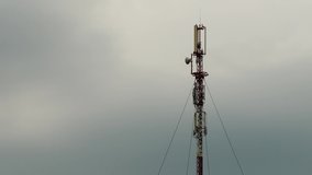 time-lapse video. Mobile antenna against the background of fast-moving clouds