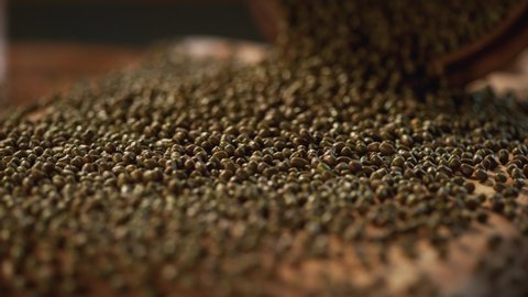 Mung bean on a delicious background and wood floor passes in front of the camera in slow motion. Macro, 4K, Phantom Camera,Very Close-up, 900 fps video.