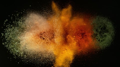Super Slow Motion Shot of Colorful Seasoning Explosion on Black Background at 1000fps.