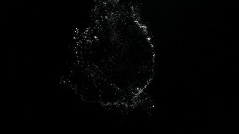 A big bubble ring exploding at the center and spreading bubbles over a black background from the Submerge collection - Water VFX Video Element.