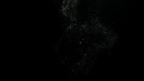 A big bubble ring bursting and spreading bubbles over a black background from the Submerge collection - Water VFX Video Element.