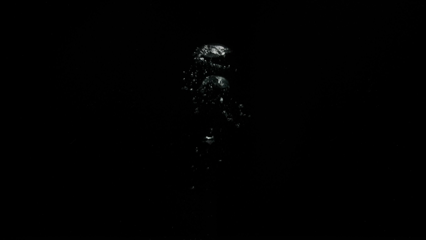 Big bubbles slowly moving upwards from the bottom on a black background from the Submerge collection - Water VFX Video Element. | Shutterstock HD Video #1057663699
