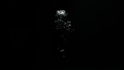 Big bubbles slowly moving from the bottom to the top on a black background from the Submerge collection - Water VFX Video Element.