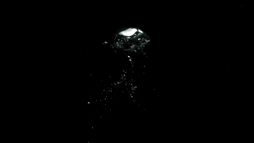 Bubbles coming out very slowly from the bottom moving upwards on a black background from the Submerge collection - Water VFX Video Element. | Shutterstock HD Video #1057663738
