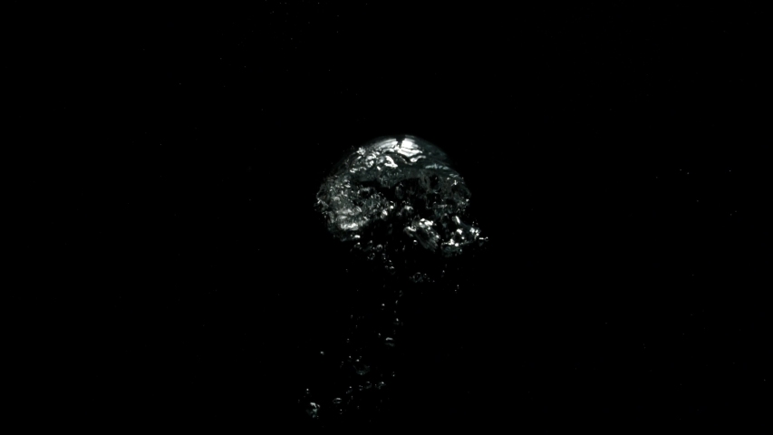 Big Bubbles flowing upwards very slowly from the bottom on a black background from the Submerge collection - Water VFX Video Element. | Shutterstock HD Video #1057663741